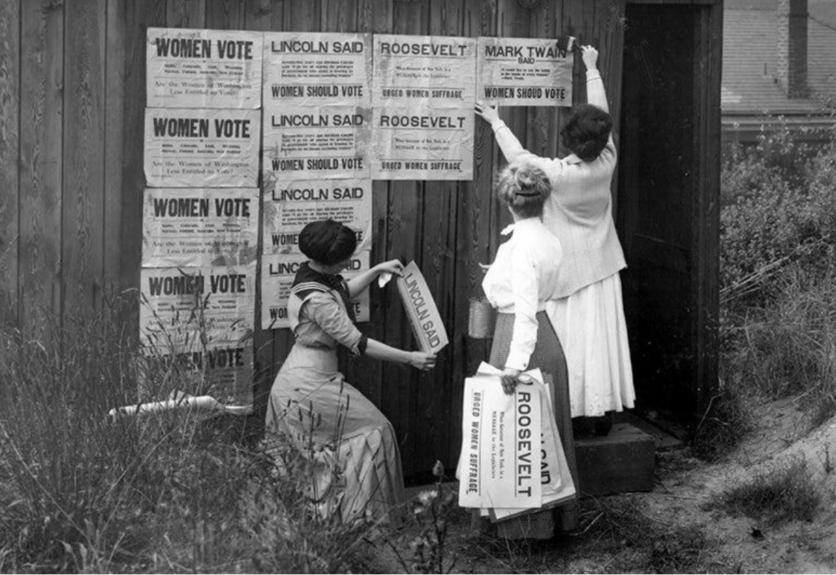 Women from the Washington Equal Suffrage Association posting signs. Seattle, 1910.