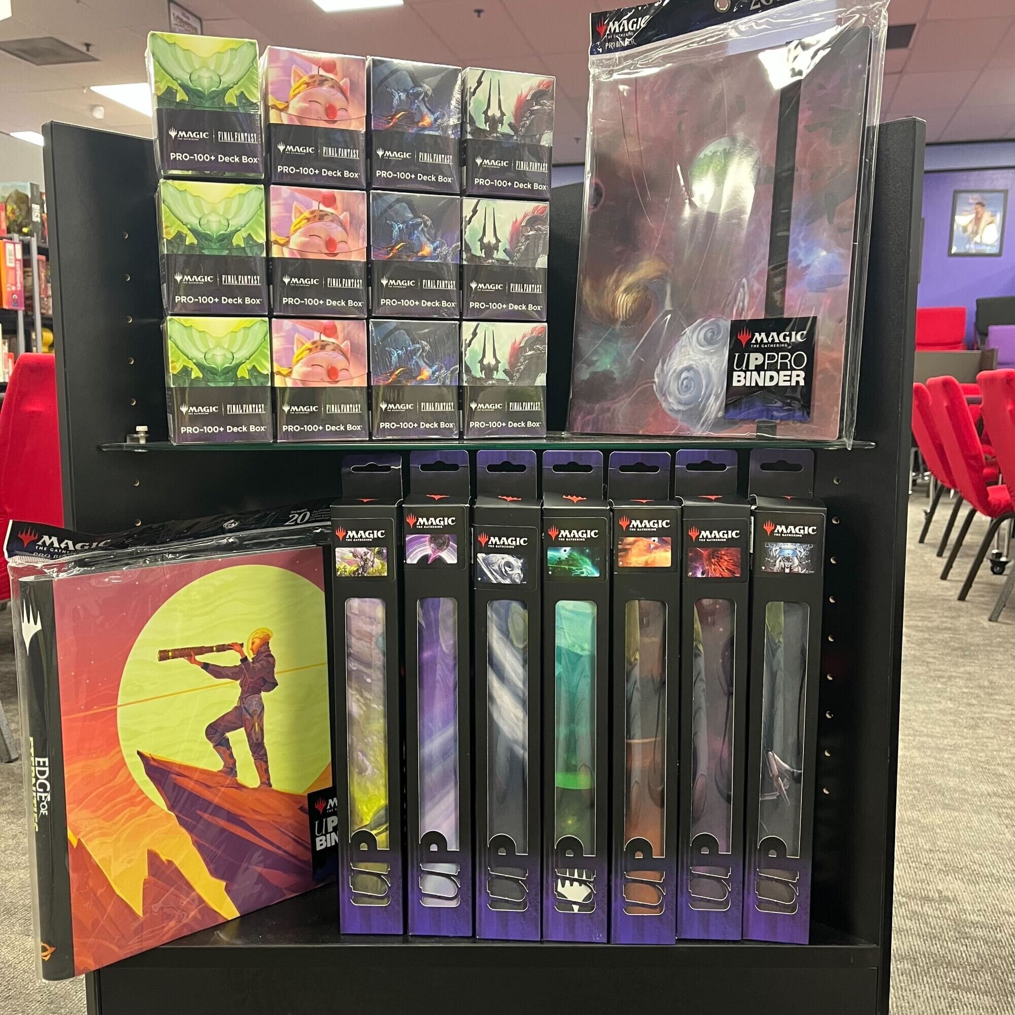 Display of Magic: the Gathering playmats, binders, and deckboxes featuring art from Edge of Eternities.