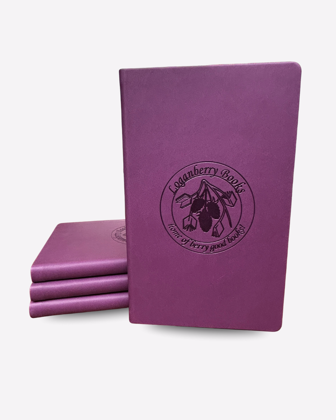 Purple leather notebook with Loganberry Books logo embossed
