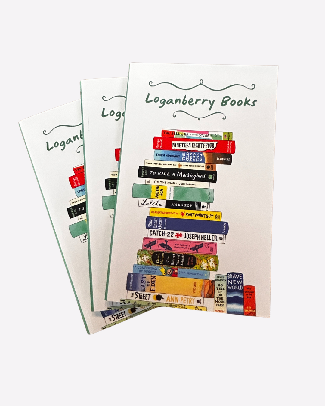 Softcover notebook with illustration of stack of classic books 