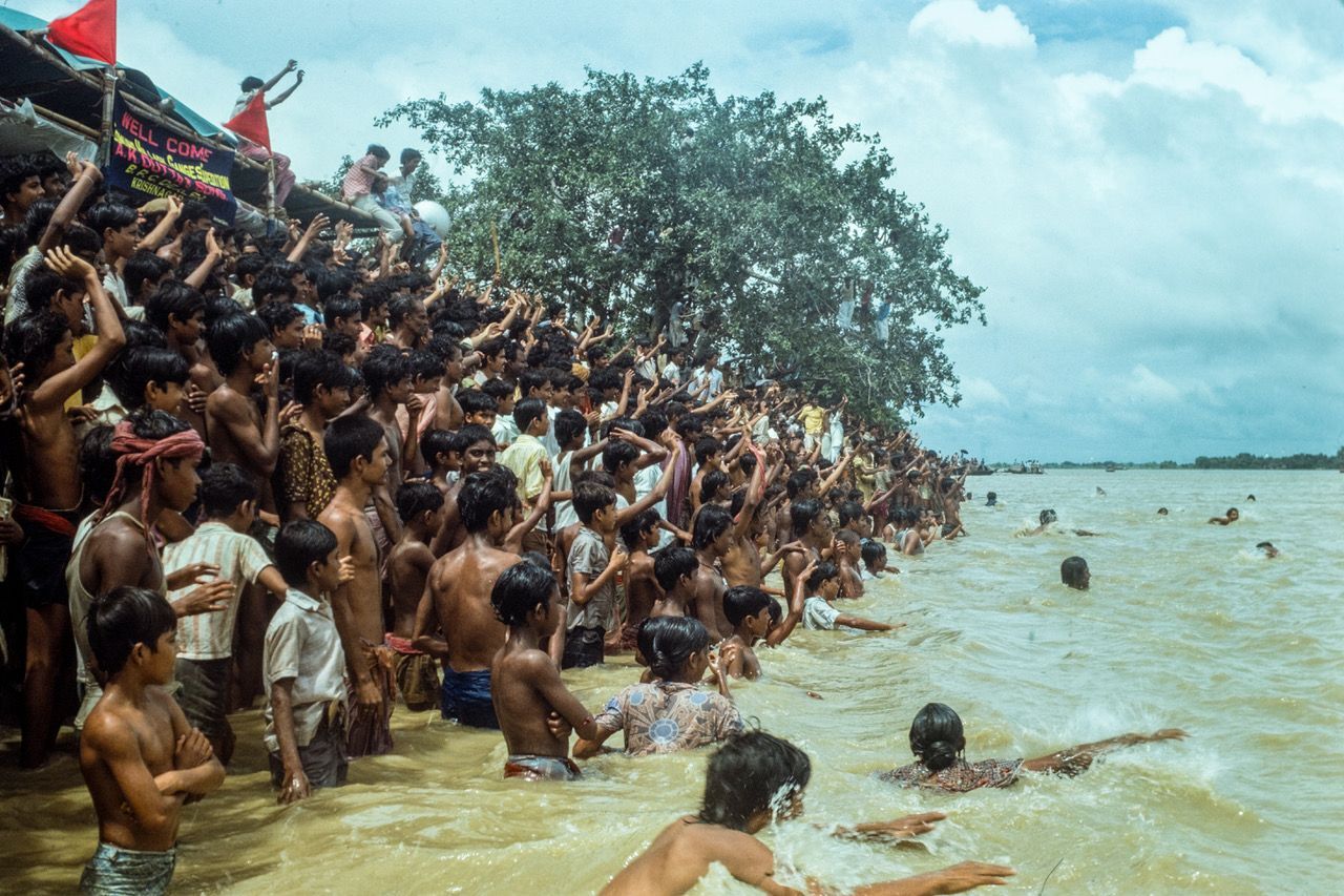 Indian people greeting the expedition jet boats