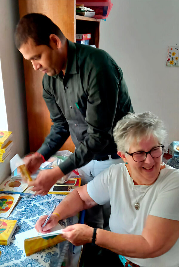 Ondy signing her books