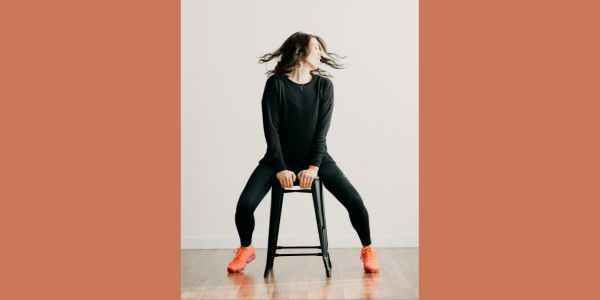 Person on stool doing yoga stretch