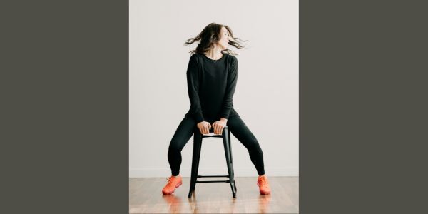 Person on stool doing yoga stretch