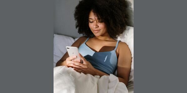Young woman looking at cell phone