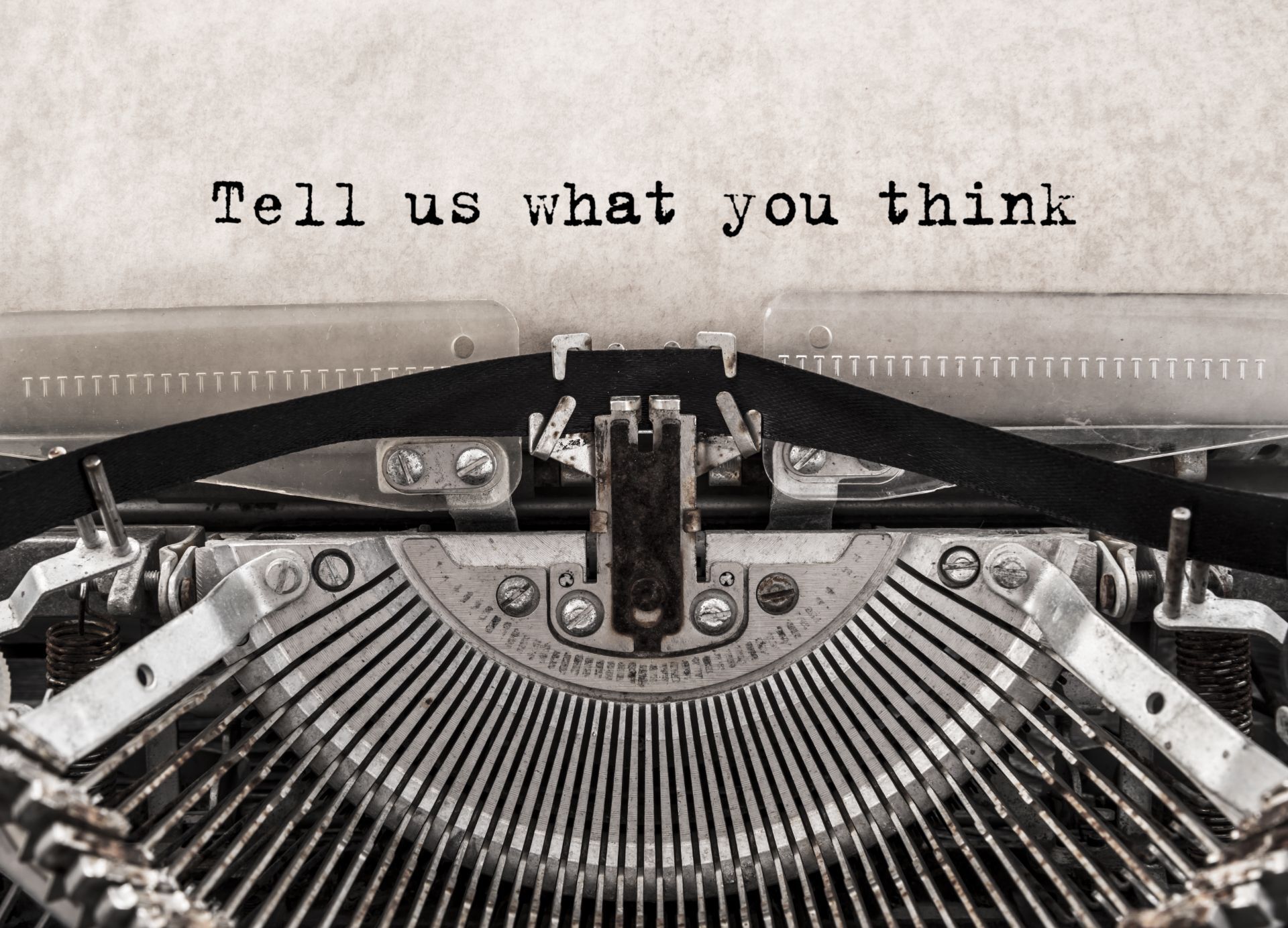 Image of typewritten page that reads "Tell us what you think"