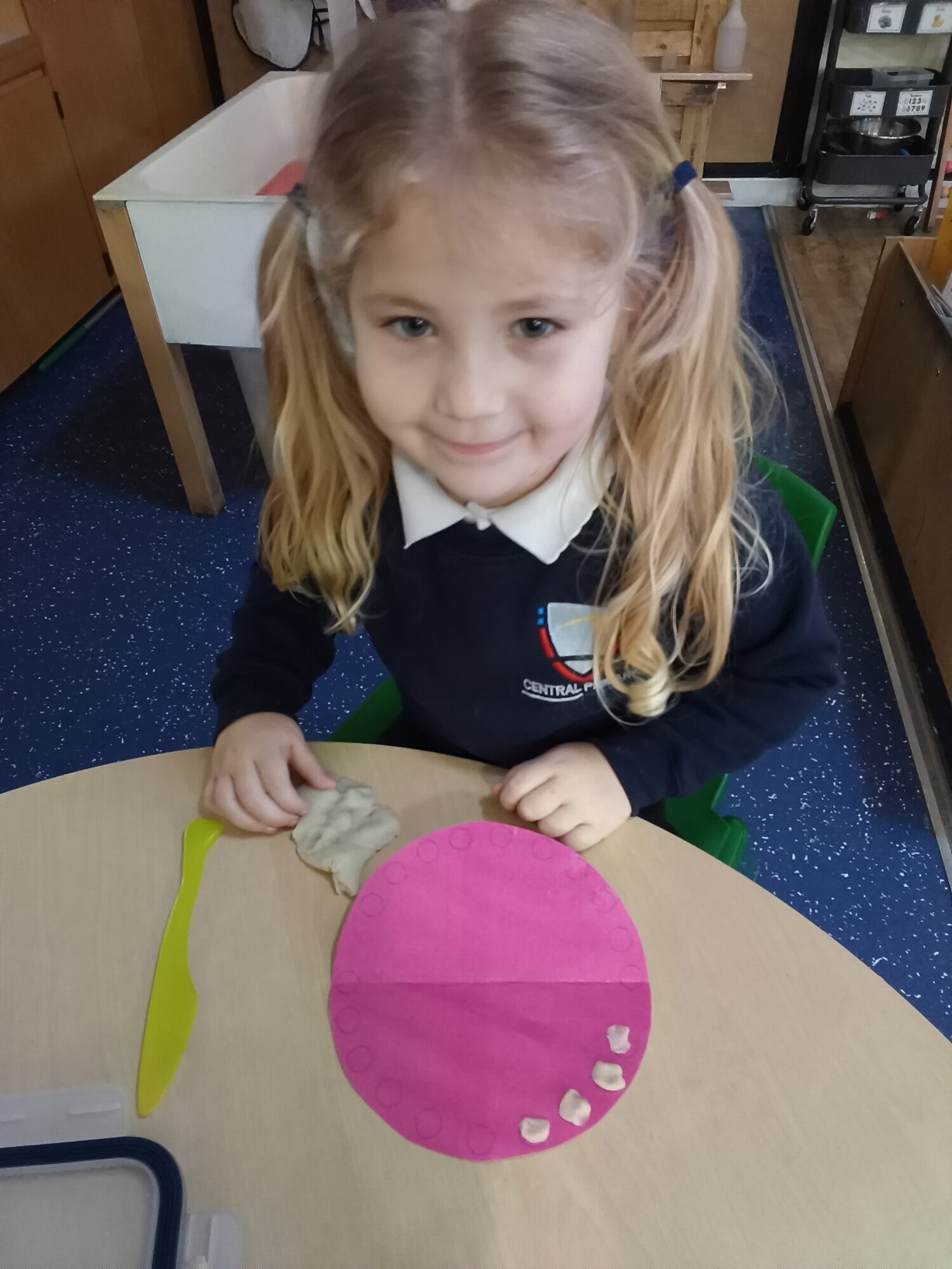 A girl learning about teeth.